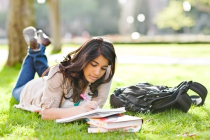 Student Studies Books in Park